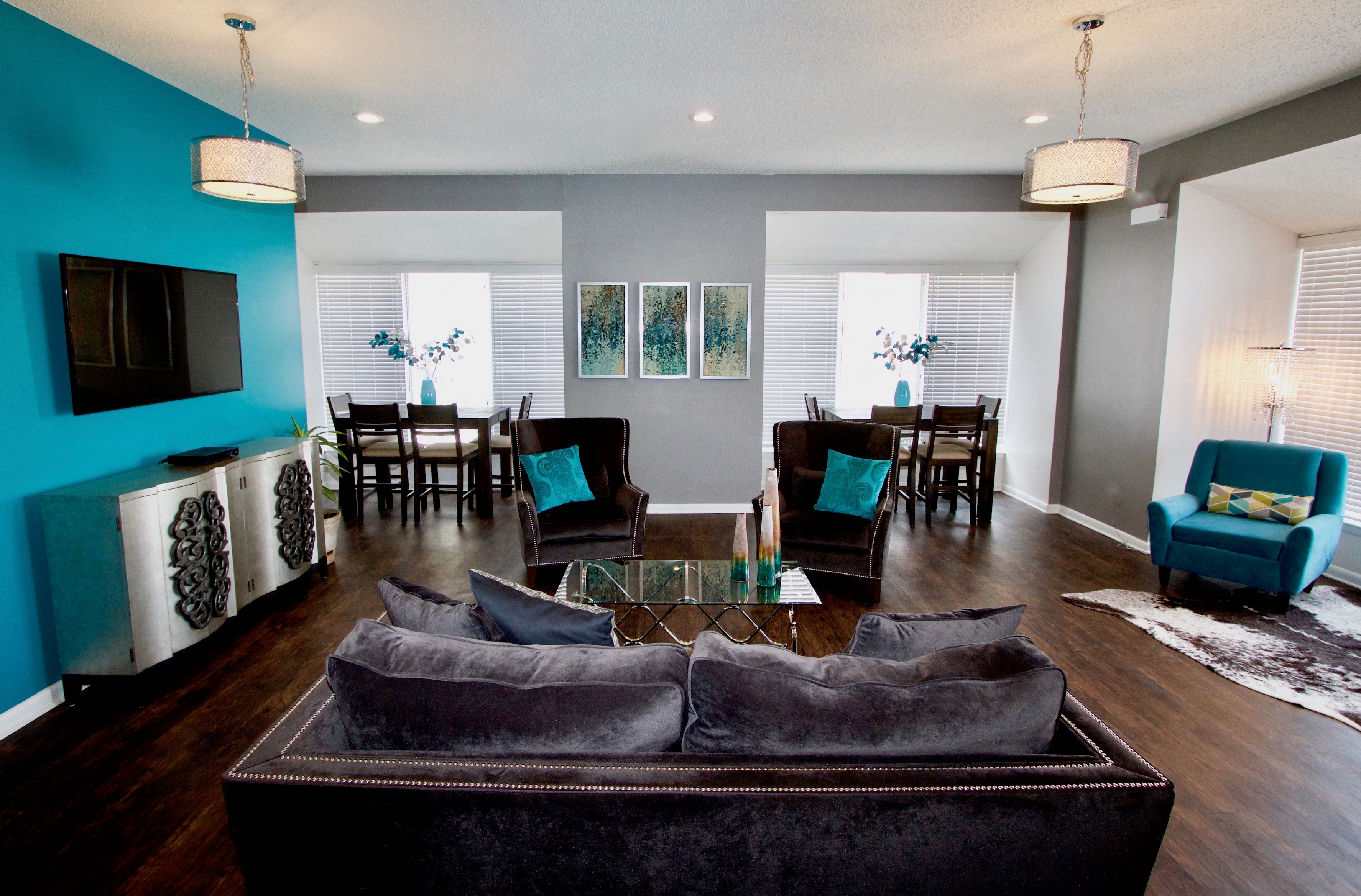 a living room and dining room with a couch and a table